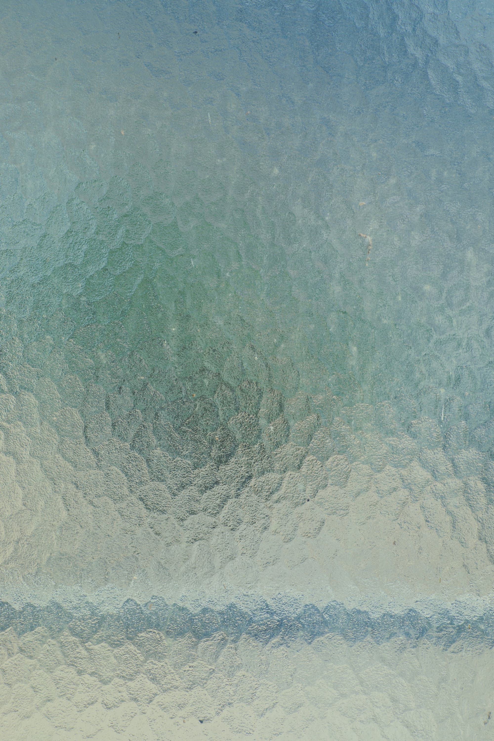 Blue-green textured material surface photographed by Markus Spiske